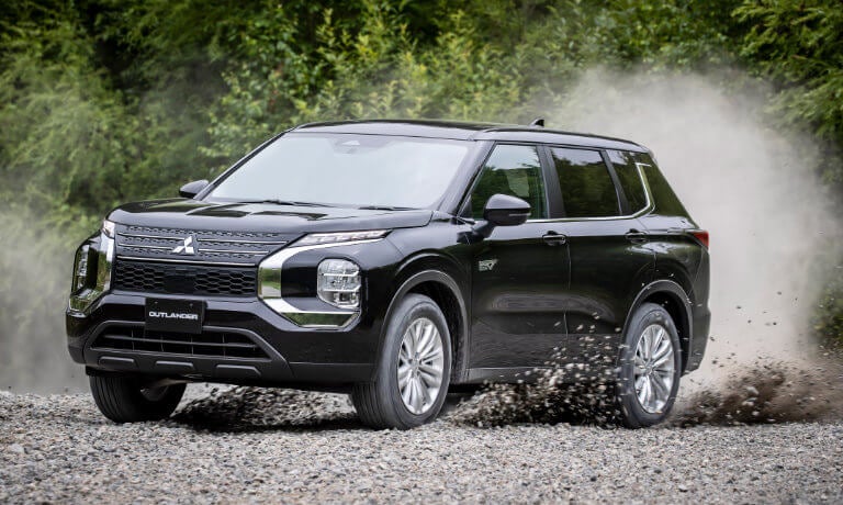 2024 Mitsubishi Outlander PHEV kicking up gravel